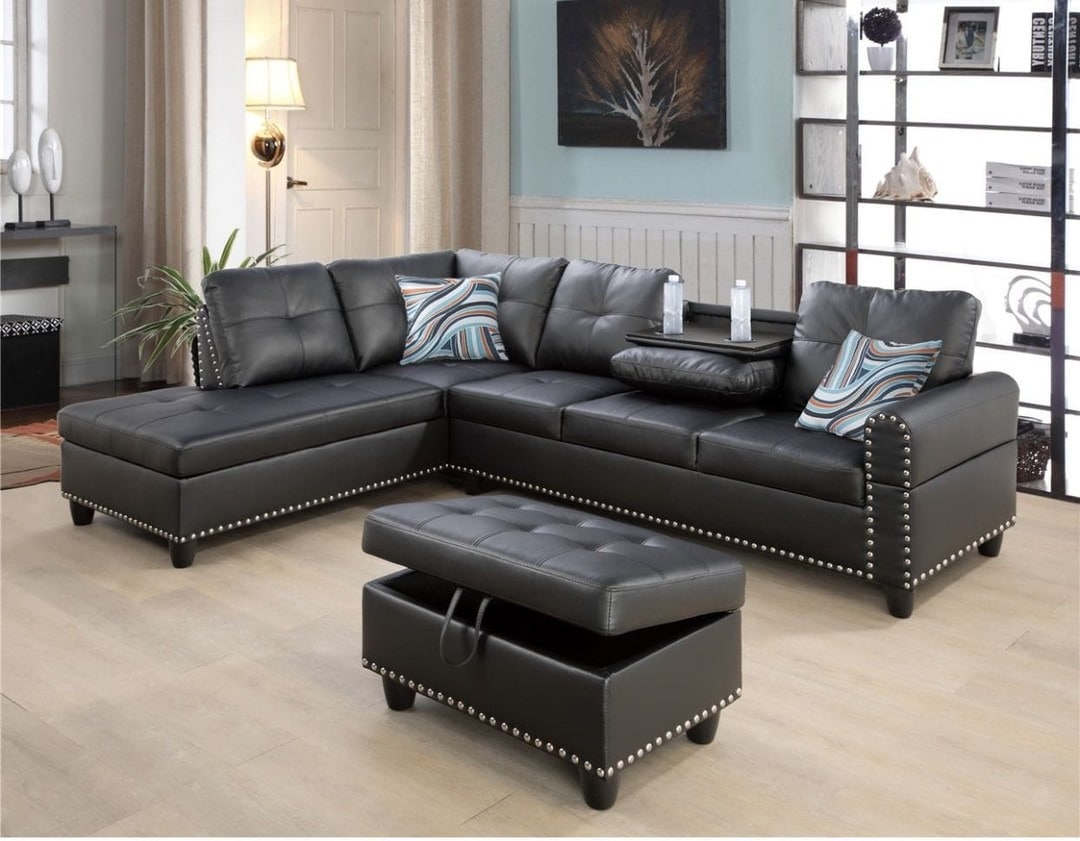 3. Black Leather Sectional with Studded Detail - black sofa living room ideas