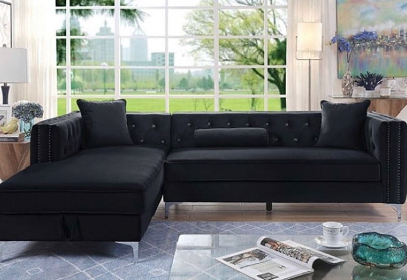 9. Black L-Shaped Sofa with Bright Window Backdrop - black sofa living room ideas