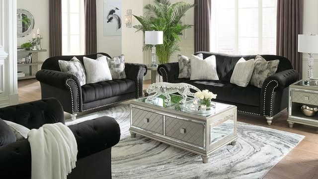 16. Classic Black Sofa Set with Neutral Layers - black sofa living room ideas
