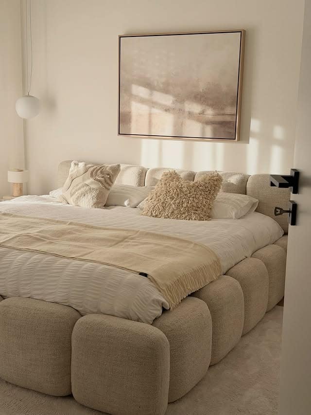 3. Soft Beige Textured Bedroom with Sculptural Bed - aesthetic bedroom ideas