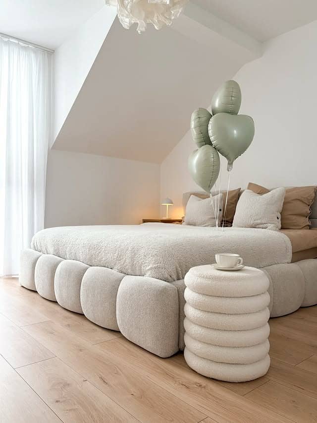 11. Soft Cream Attic Bedroom with Sage Accents - aesthetic bedroom ideas