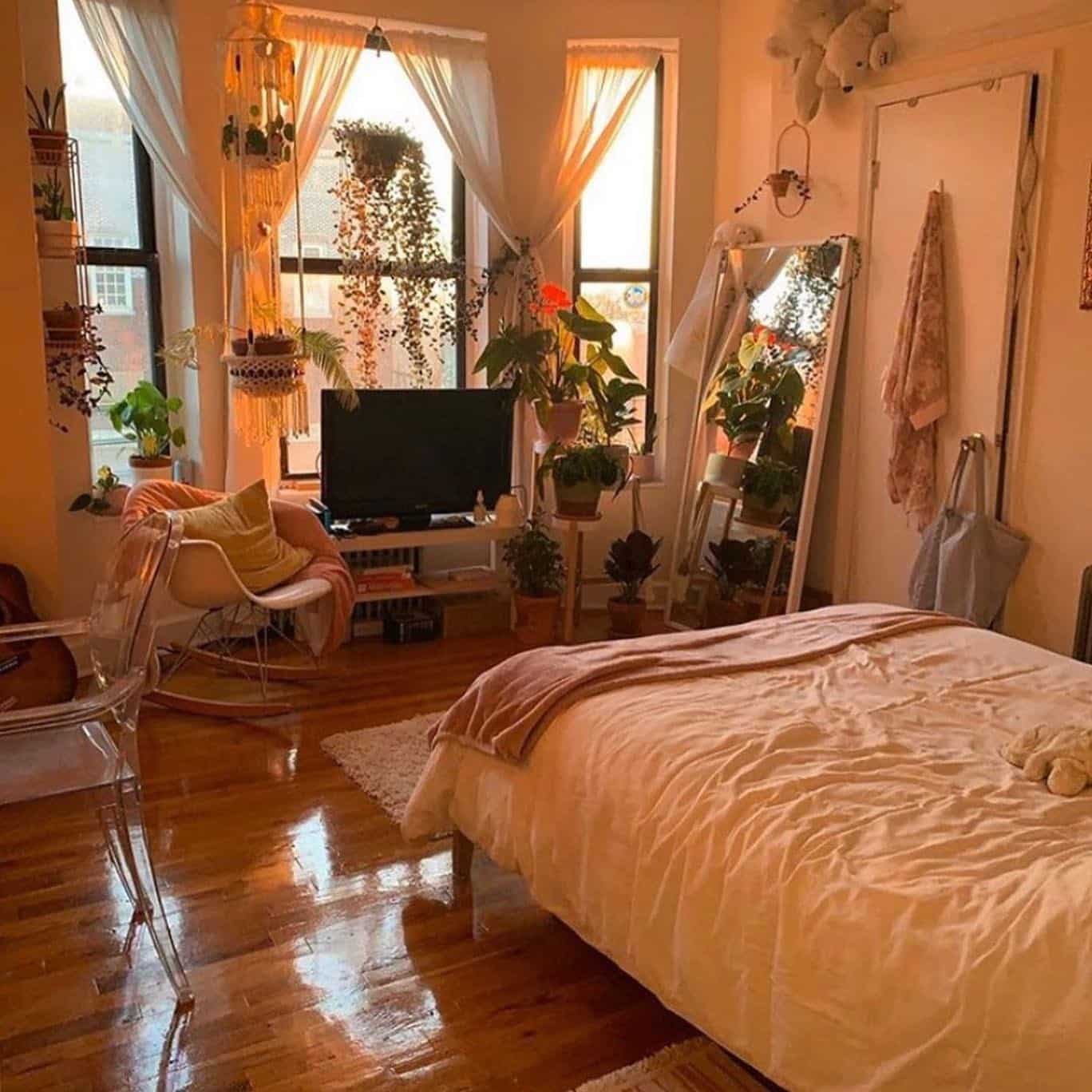 22. Warm Sunlit Bedroom with Plants and Amber Tones - aesthetic bedroom ideas