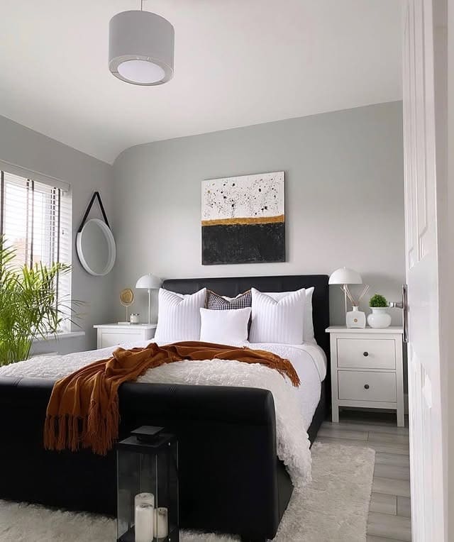 1. Soft Minimal Black and White Bedroom with Warm Accent - black and white bedroom ideas