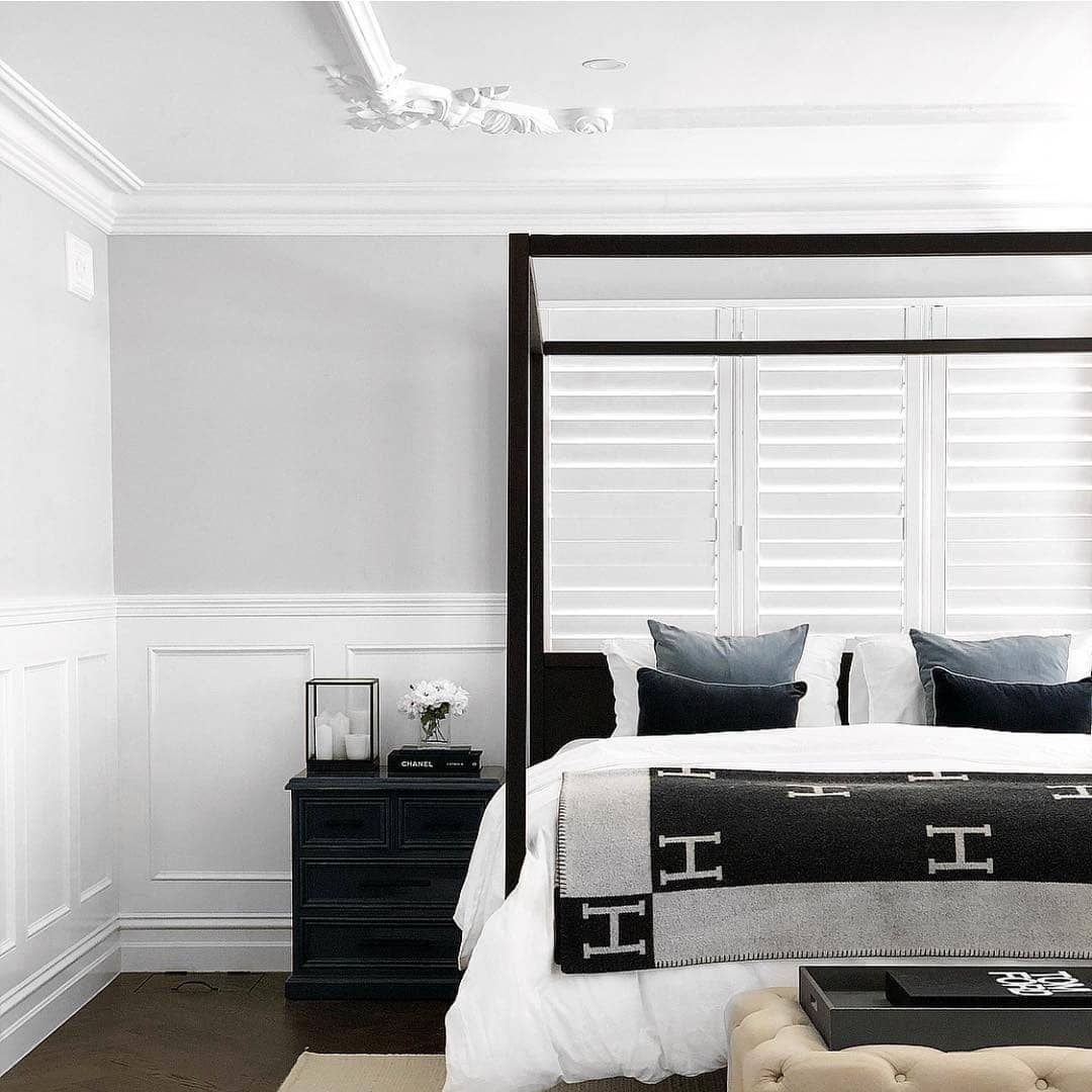 4. Classic Black and White Bedroom with Paneled Walls - black and white bedroom ideas