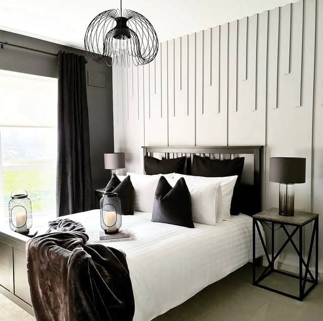 5. Modern Textured Black and White Bedroom Feature Wall - black and white bedroom ideas