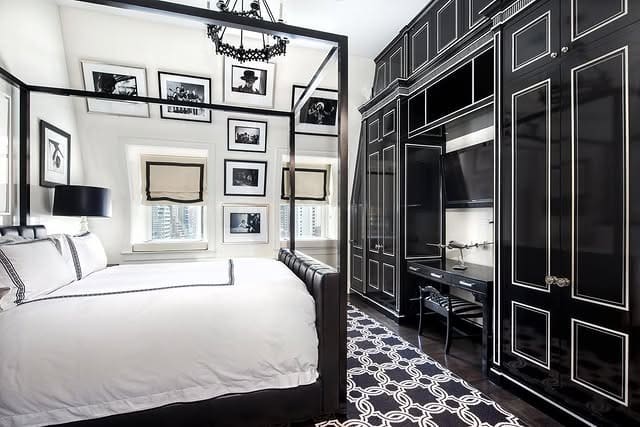13. Bold Black and White Bedroom with Statement Cabinetry - black and white bedroom ideas