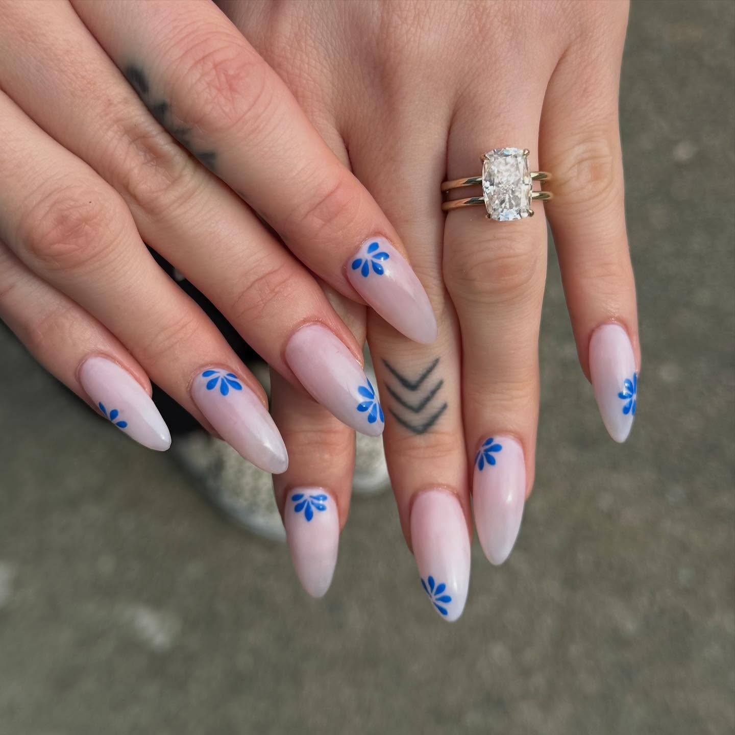 21. Soft Nude Almond Nails with Blue Floral Accents - mexico nail ideas