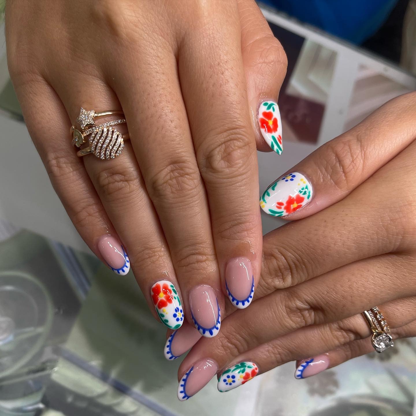 22. Nude Almond Nails with Blue Scalloped French Tips and Floral Art - mexico nail ideas