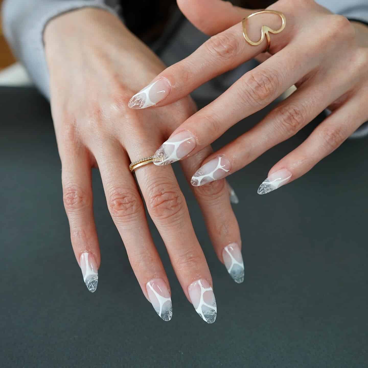 2. Frosted French Marble Stiletto Nails - ice nail ideas