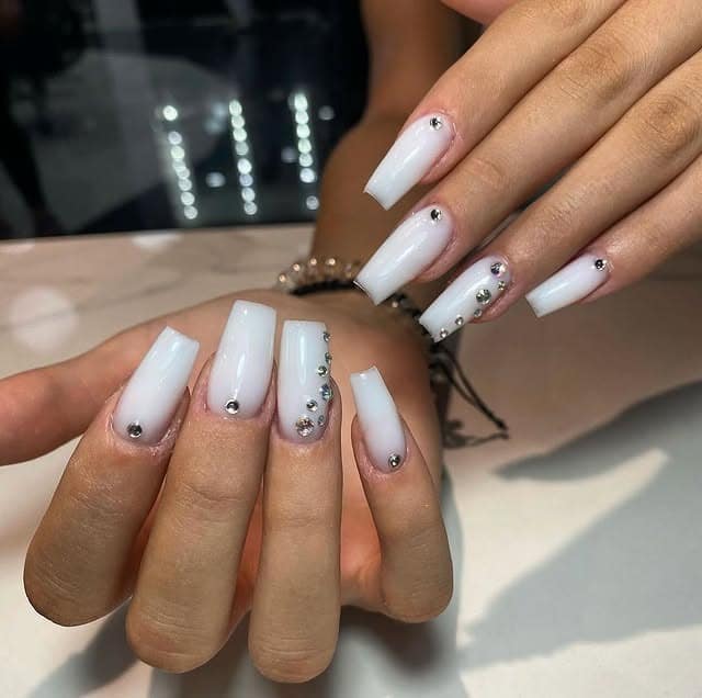6. Milky White Coffin Nails with Rhinestone Details - ice nail ideas