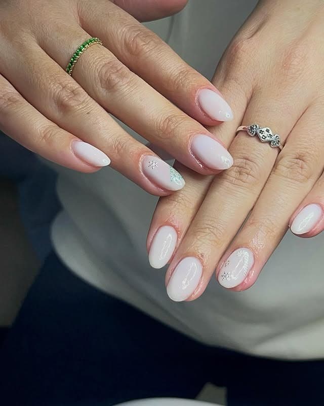 7. Soft Snowy Nude Almond Nails with Subtle Art - ice nail ideas