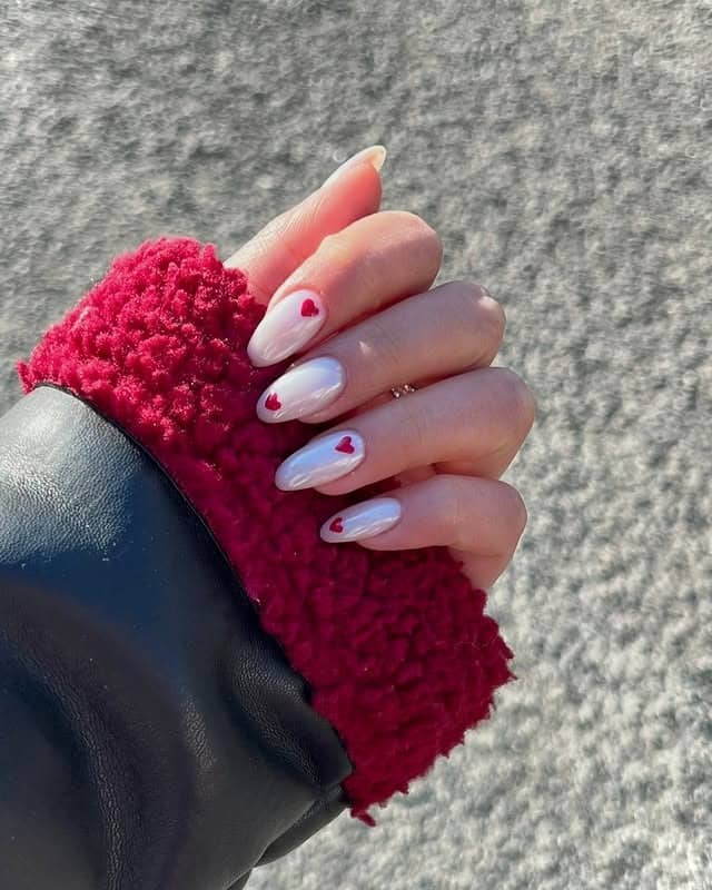 18. Milky White Almond Nails with Tiny Red Heart Accents - ice nail ideas
