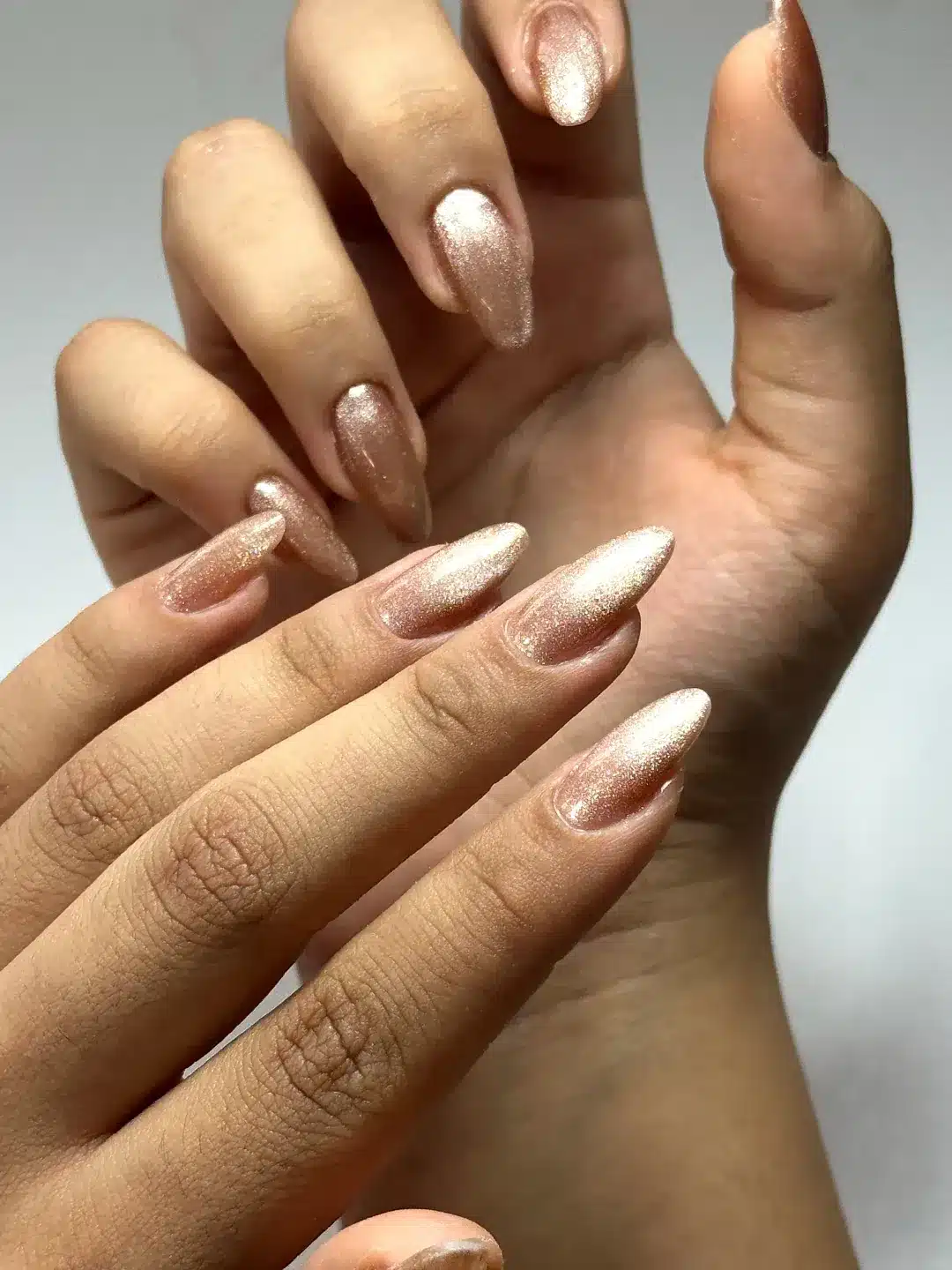21. Rose Gold Shimmer Almond Nails - ice nail ideas