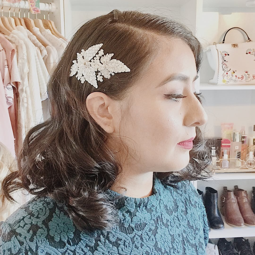 18. Chocolate Brown Short Vintage Curl Bob with Floral Clip - Vintage Curls Hairstyles