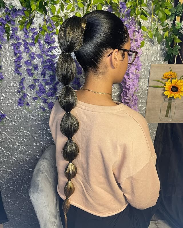 9. Jet Black Sculpted Bubble Ponytail - Bubble Ponytail