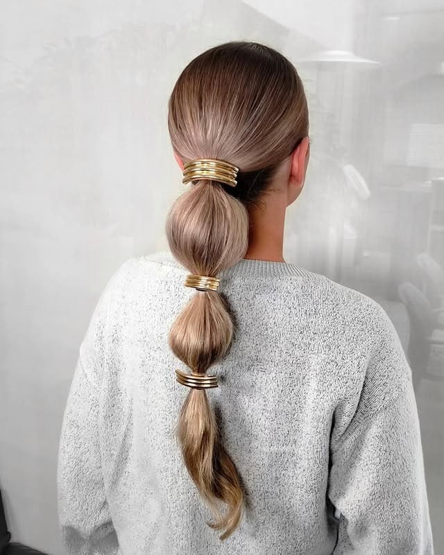 22. Cool Blonde Metallic Accent Bubble Ponytail - Bubble Ponytail