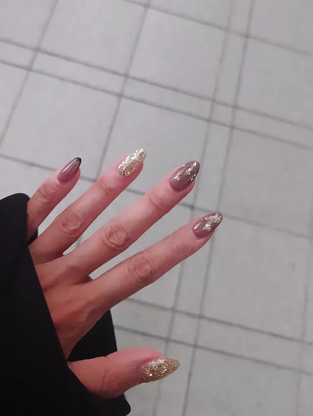 2. Gold Accent Neutral Almond Nails - simple nail ideas