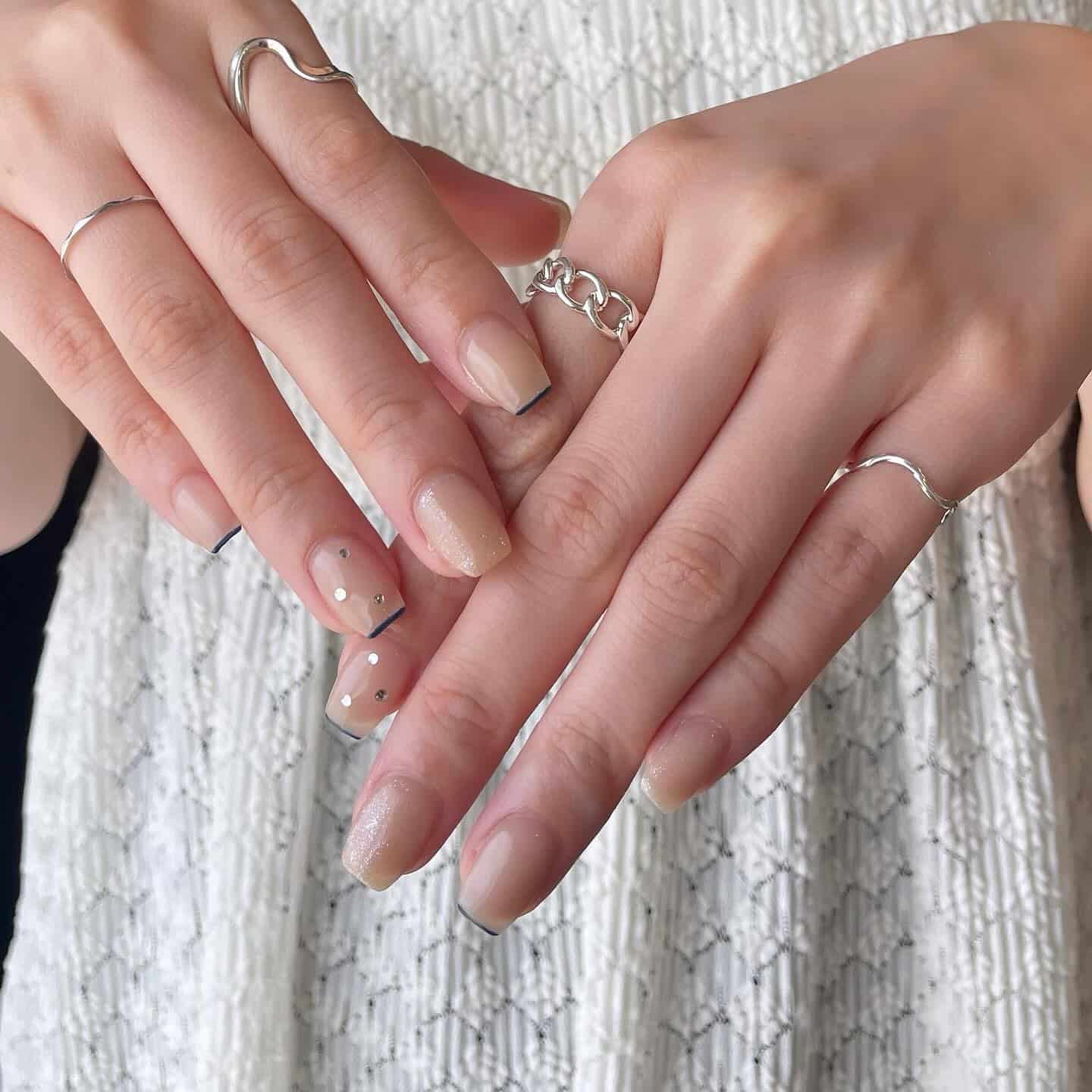 3. Nude French Tip with Minimal Dot Art - simple nail ideas