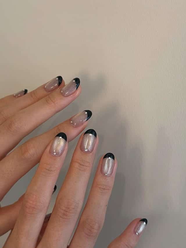 10. Black French Tip with Iridescent Base - simple nail ideas