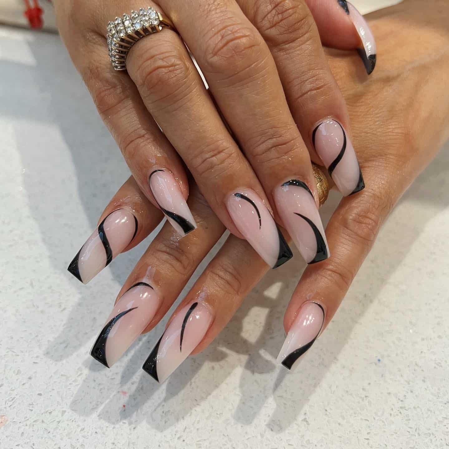 19. Nude Coffin Nails with Black Abstract French Lines - simple nail ideas