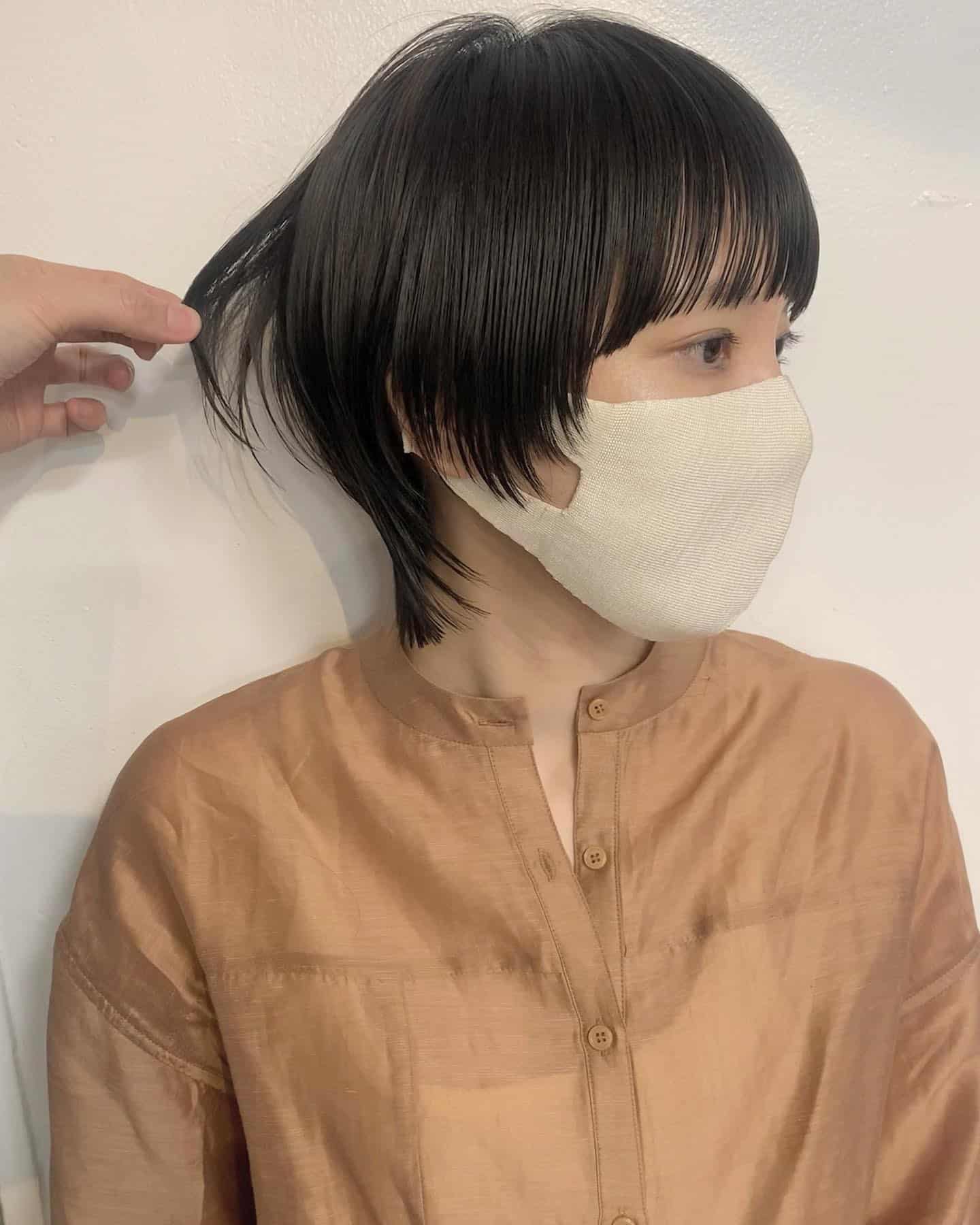 5. Sleek Black Short Wolf Cut with Subtle Undercurve - Short Wolf Haircut