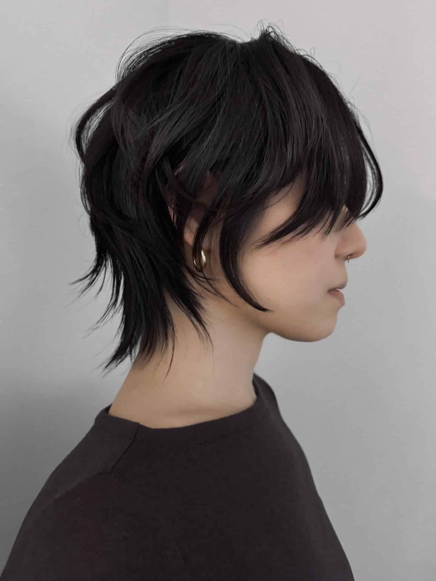 10. Tousled Black Mini Wolf Cut with Wispy Layers - Short Wolf Haircut