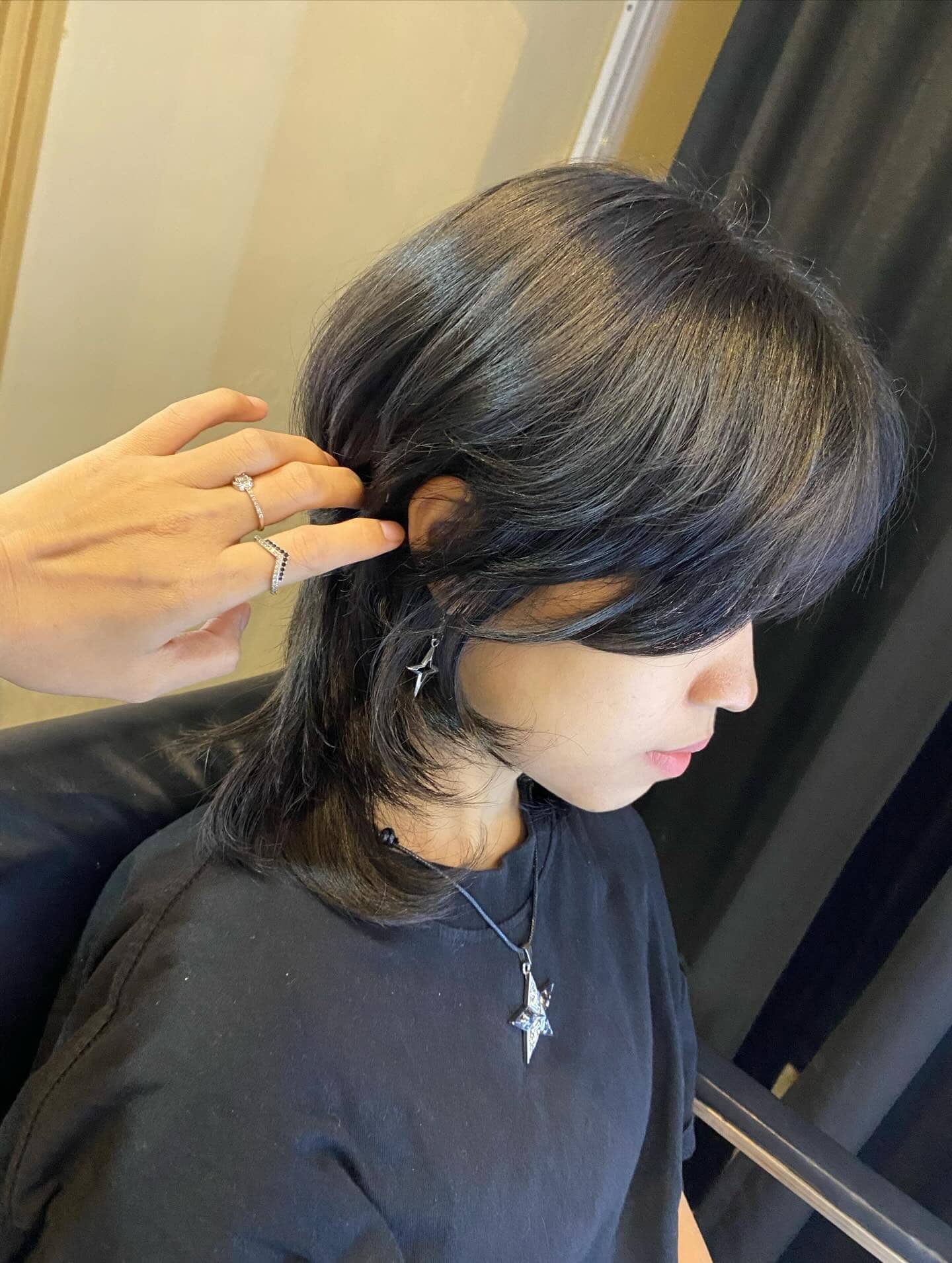 20. Glossy Black Layered Wolf Cut with Defined Face Frame - Short Wolf Haircut