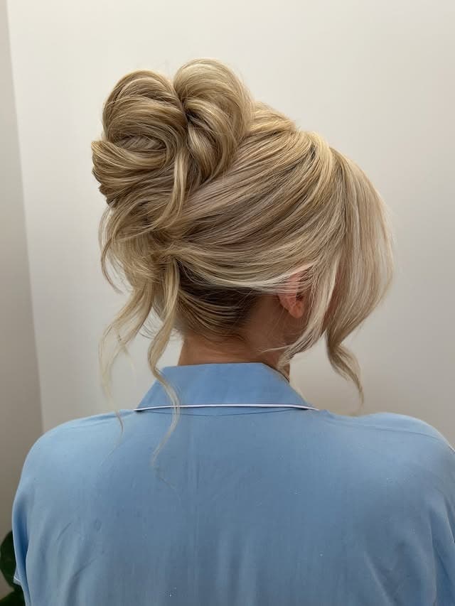 2. Light Blonde Tousled High Bun - Medium Length Hair Messy Updos