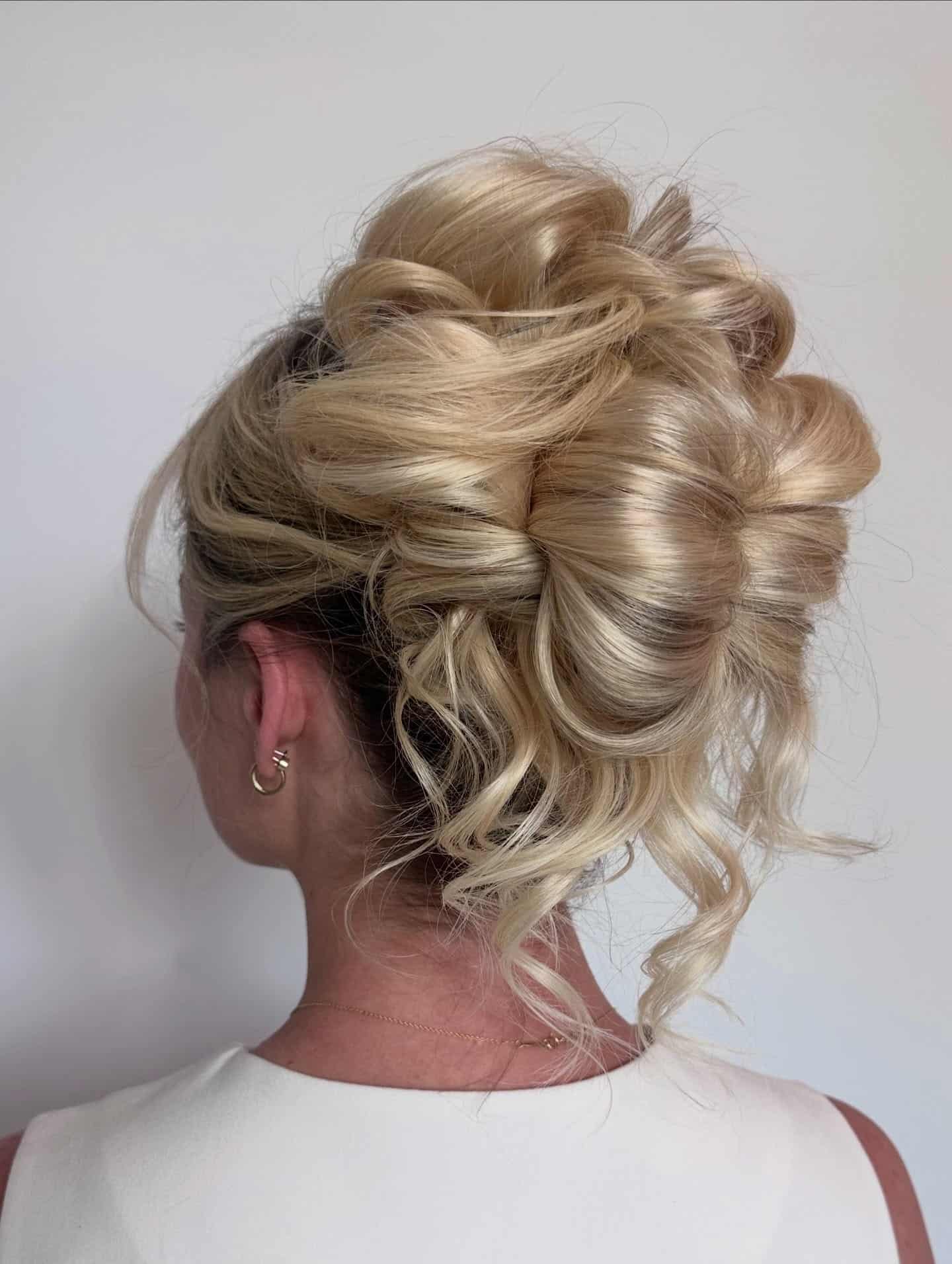 9. Bronde Low Twisted Chignon - Medium Length Hair Messy Updos