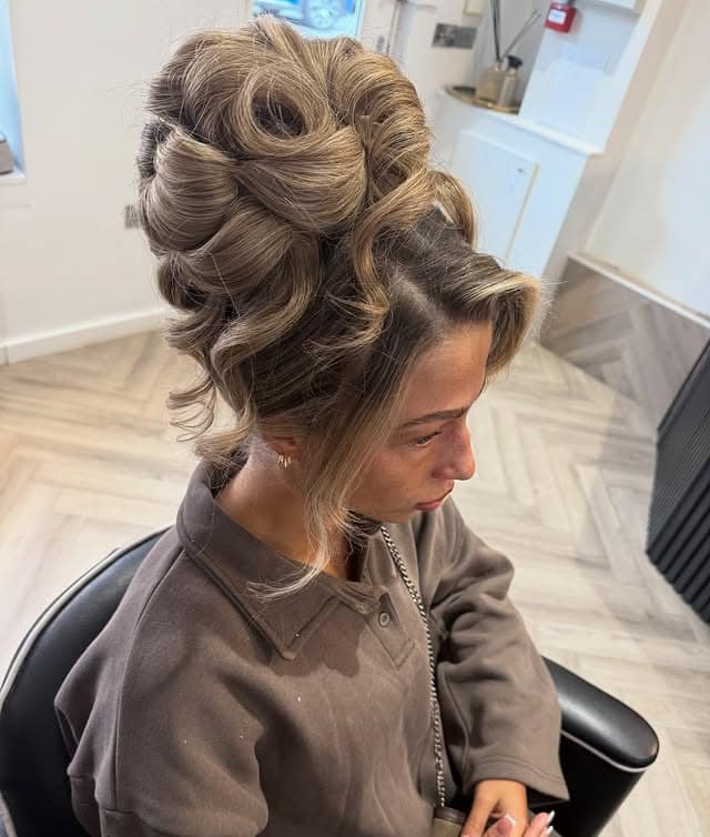 11. Sandy Blonde Voluminous Twisted Updo - Medium Length Hair Messy Updos