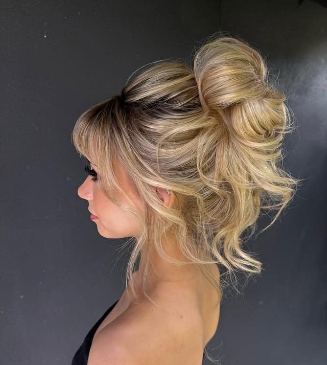 16. Golden Blonde High Loop Bun - Medium Length Hair Messy Updos