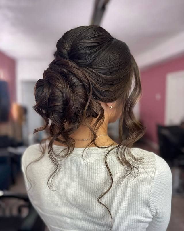 18. Dark Chocolate Twisted Low Bun - Medium Length Hair Messy Updos