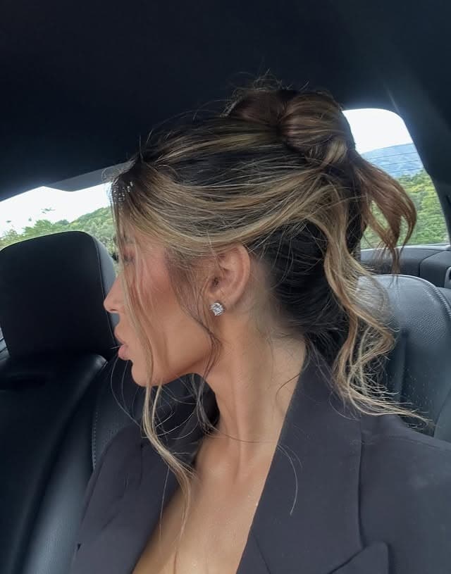 19. Bronde Textured Messy Bun with Loose Waves - Medium Length Hair Messy Updos