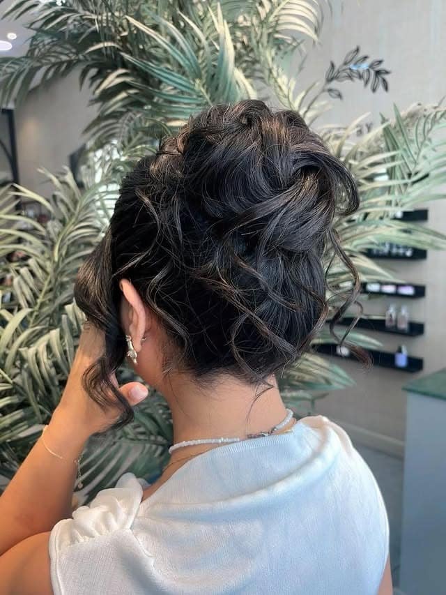 20. Soft Black Tousled High Updo - Medium Length Hair Messy Updos