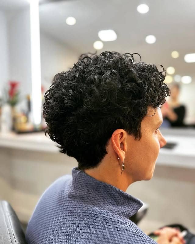 7. Jet Black Curly Pixie with Clean Taper - Curly Pixie Cut