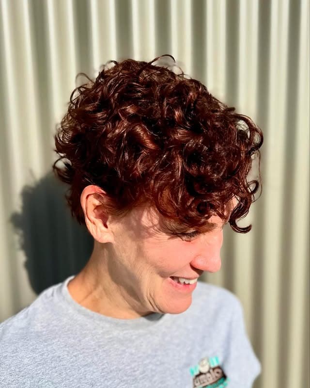 12. Deep Auburn Curly Pixie with Soft Fringe - Curly Pixie Cut