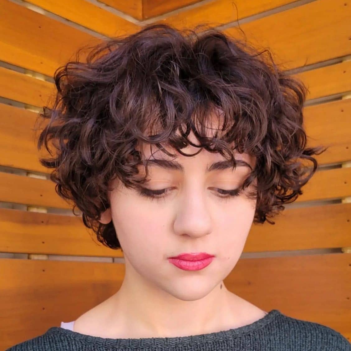 20. Dark Chocolate Curly Pixie with Wispy Fringe - Curly Pixie Cut