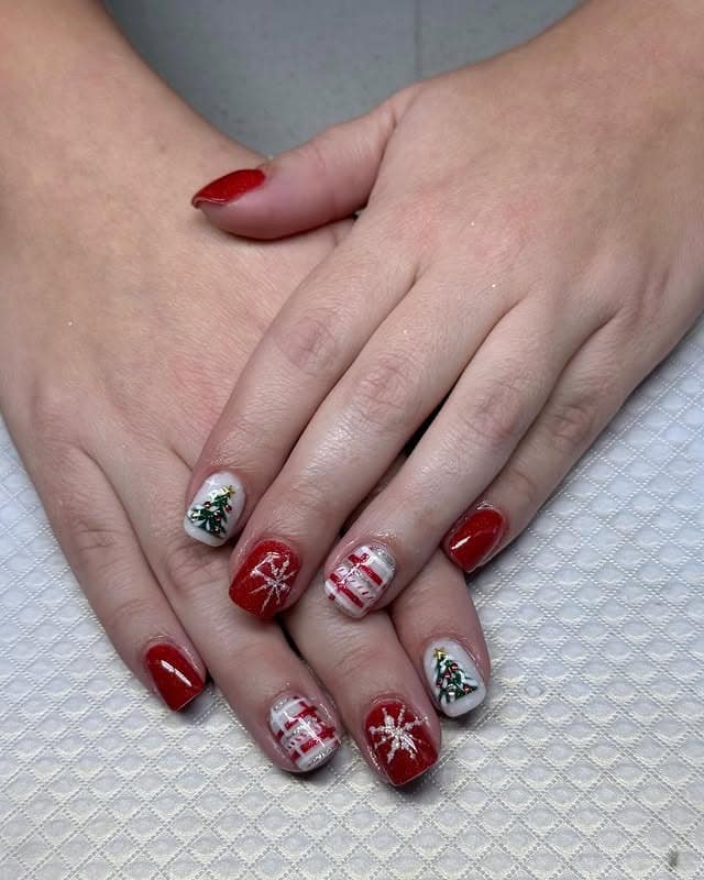 2. Short Red Christmas Mix with Tree and Snowflake Art - christmas dip nail ideas