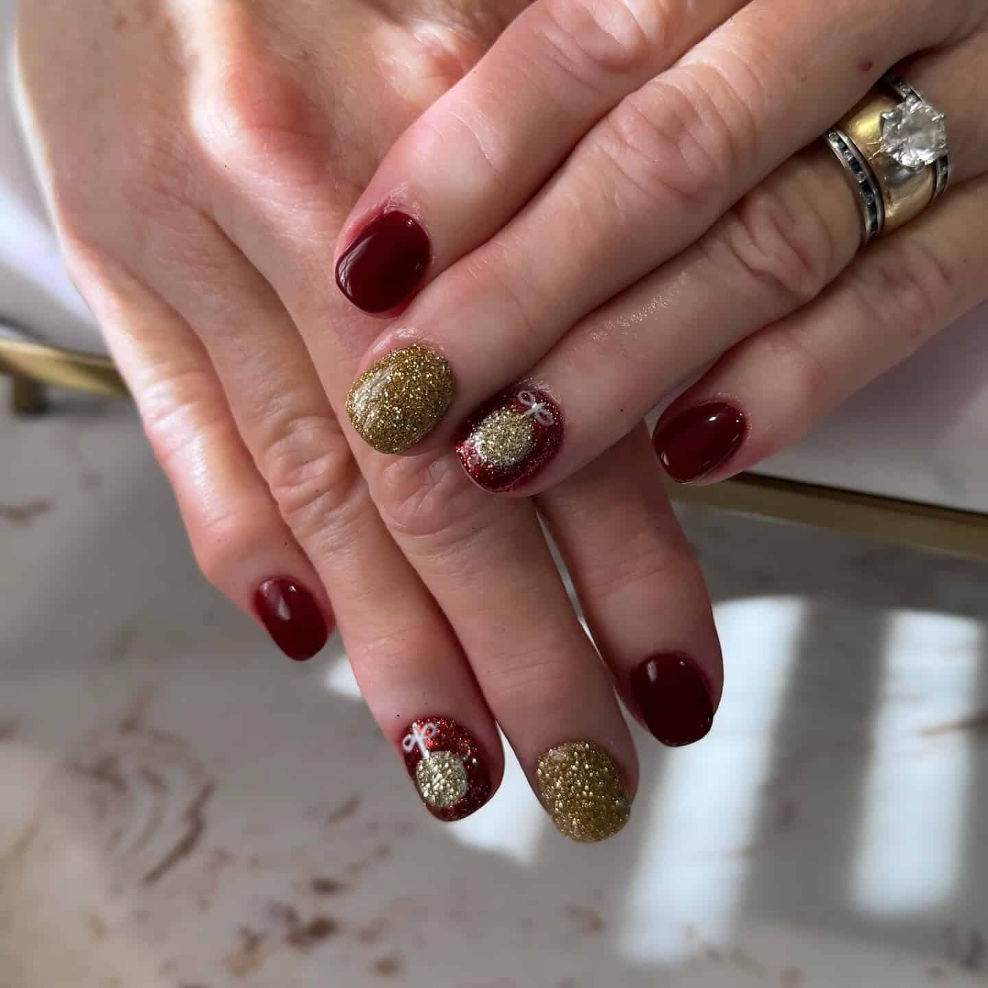 3. Deep Red and Gold Glitter Accent Holiday Nails - christmas dip nail ideas