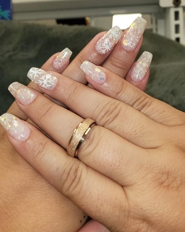 7. Icy White Glitter Snowflake Winter Nails - christmas dip nail ideas