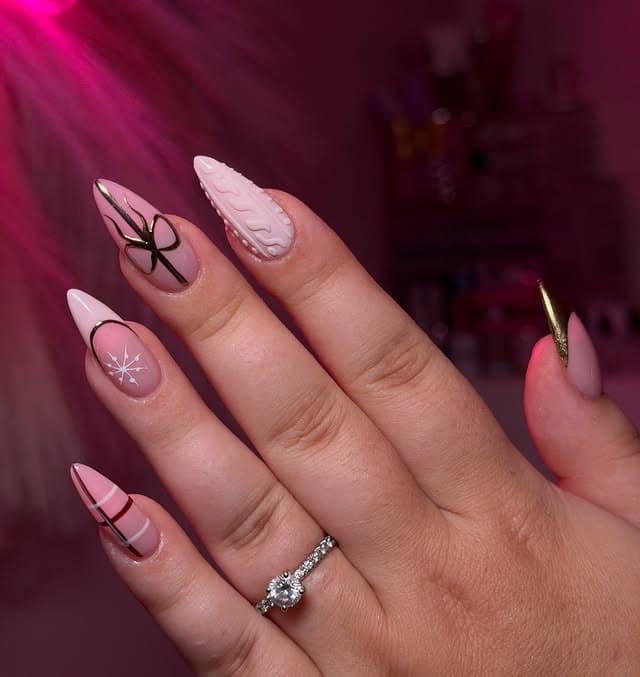 13. Soft Pink Sweater Texture Nails with Bow and Snowflake Art - christmas dip nail ideas