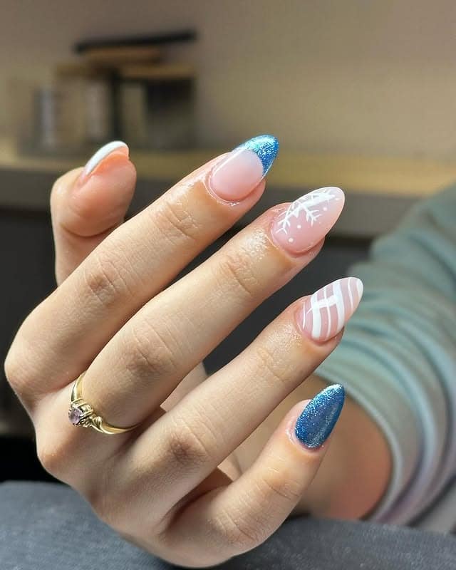 14. Icy Blue Glitter French Tip Nails with Snowflake Design - christmas dip nail ideas