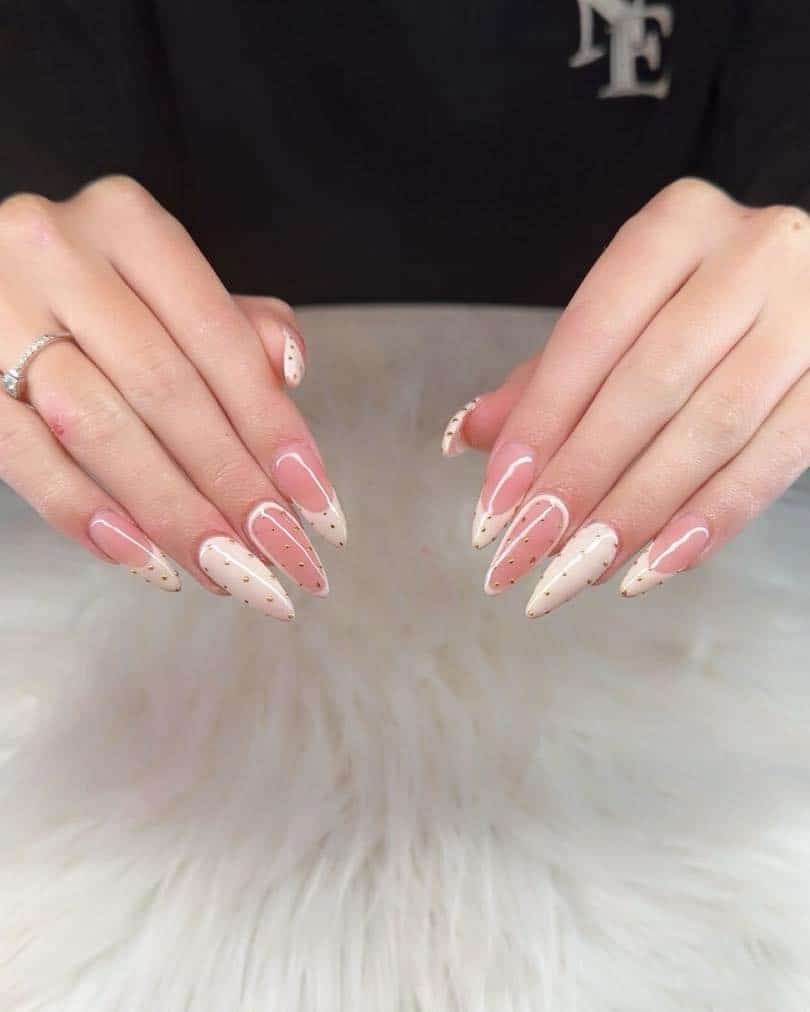 15. Nude and Cream Almond Nails with Gold Dot Detailing - christmas dip nail ideas