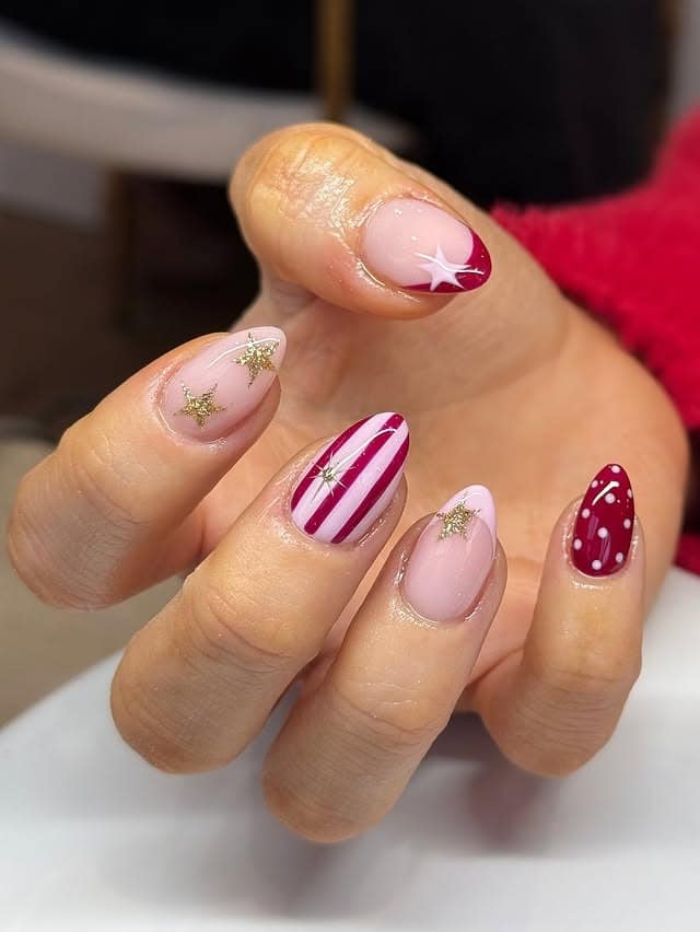18. Pink and Red Holiday Nails with Star and Stripe Accents - christmas dip nail ideas