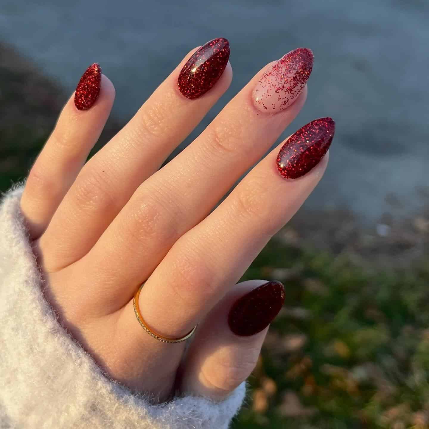 21. Deep Red Glitter Ombre Almond Nails - christmas dip nail ideas