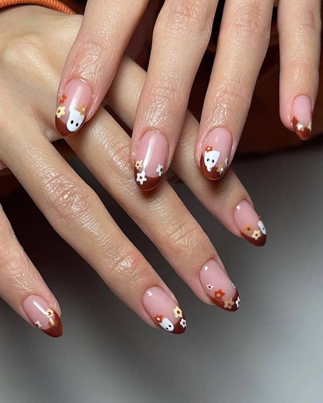 4. Brown French Tips with Cute Floral Accents - cute nail ideas