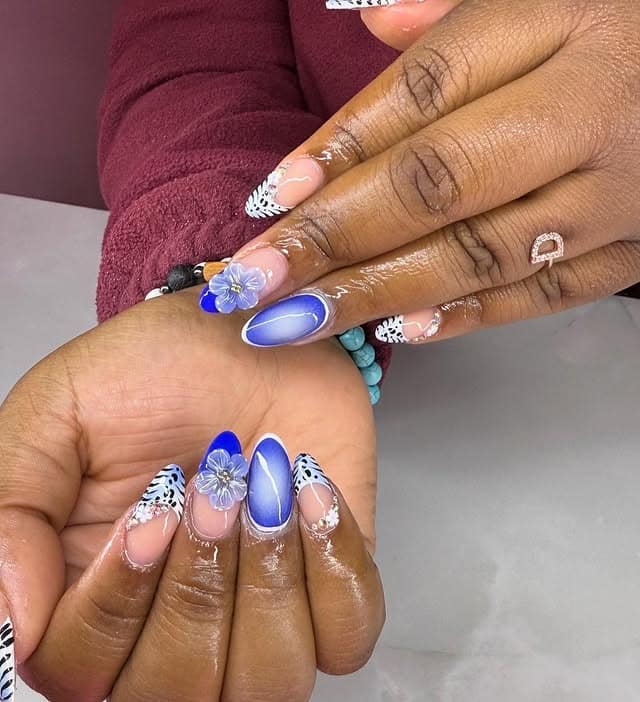12. Royal Blue Ombre Almond Nails with Floral Accent - cute nail ideas