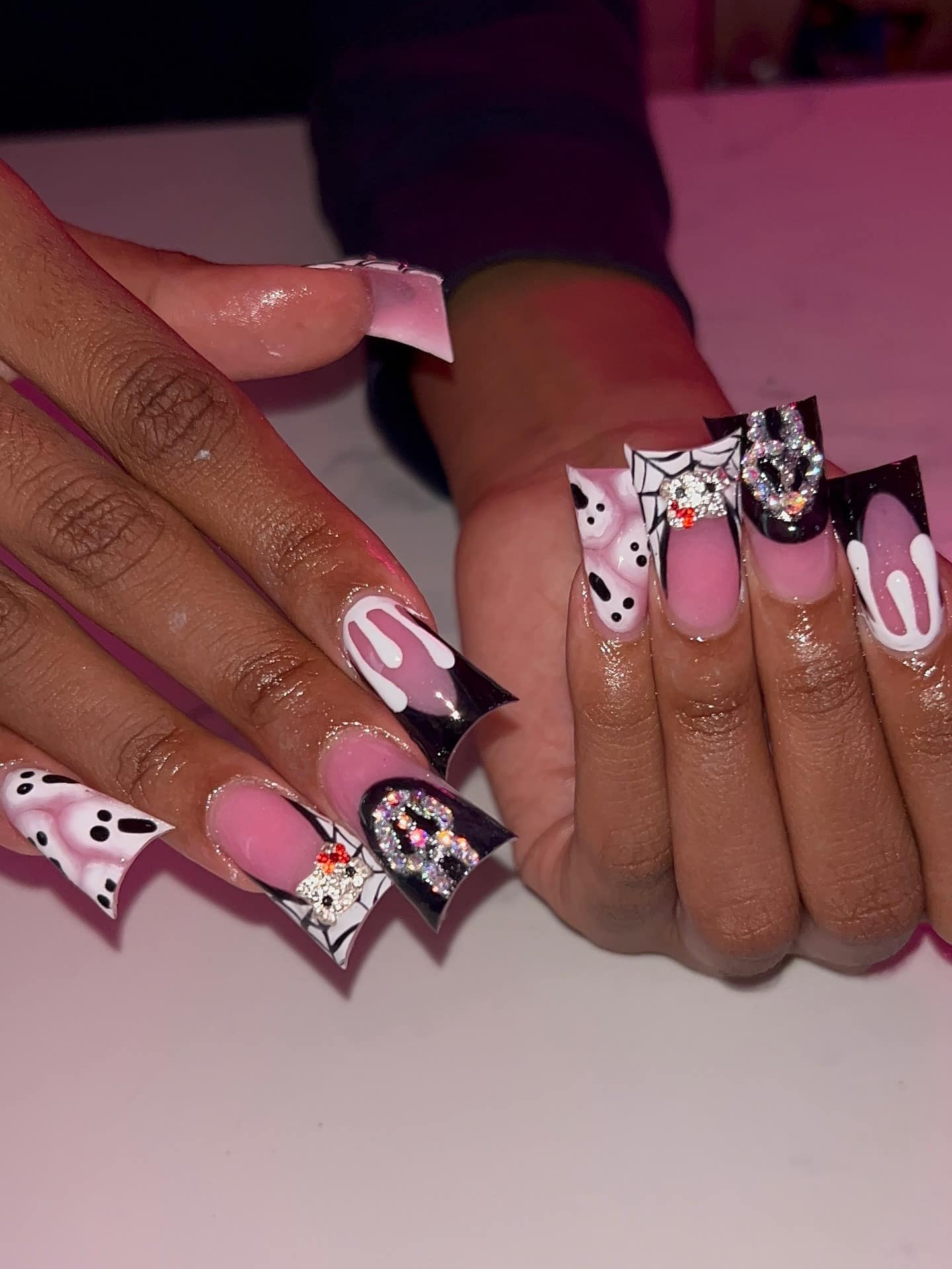 14. Black and White Stiletto Nails with Rhinestone Details - cute nail ideas