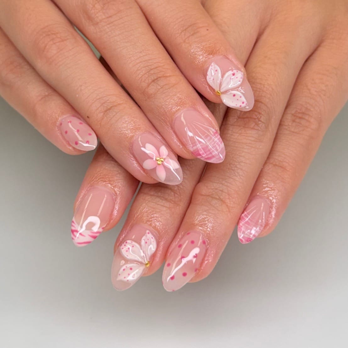 15. Soft Pink Almond Nails with Floral and Plaid Art - cute nail ideas