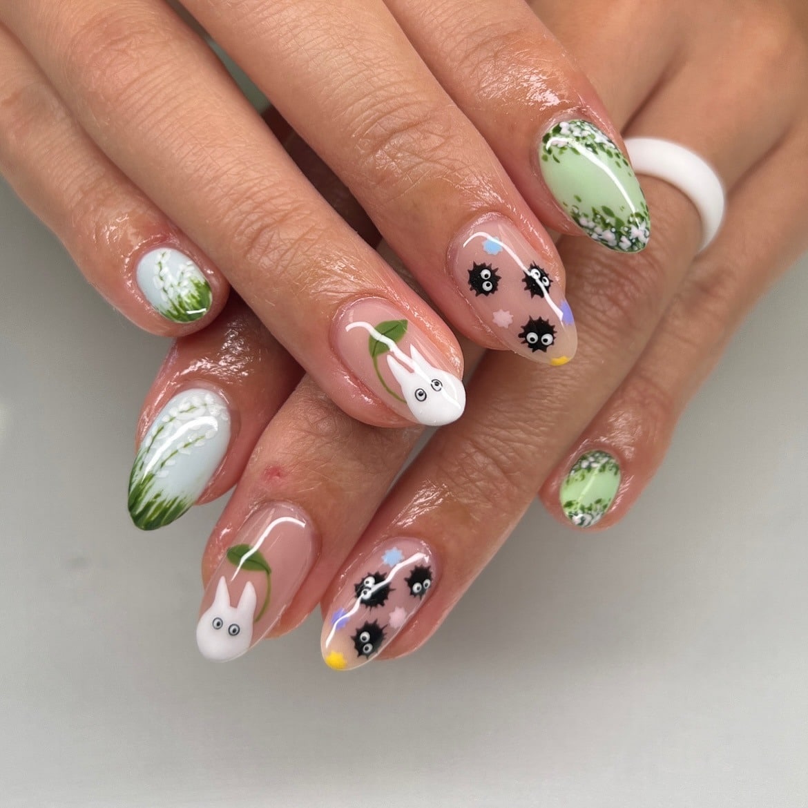 16. Green Botanical Nails with Character Art - cute nail ideas
